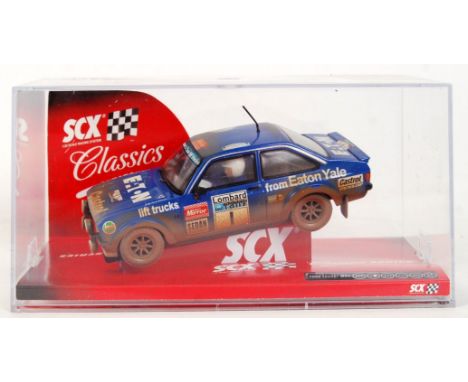 An original contemporary 1/32 scale SCX 63560 Ford Escort MKII "Eaton Yale #1" weathered dirt effect plastic racing slot car.