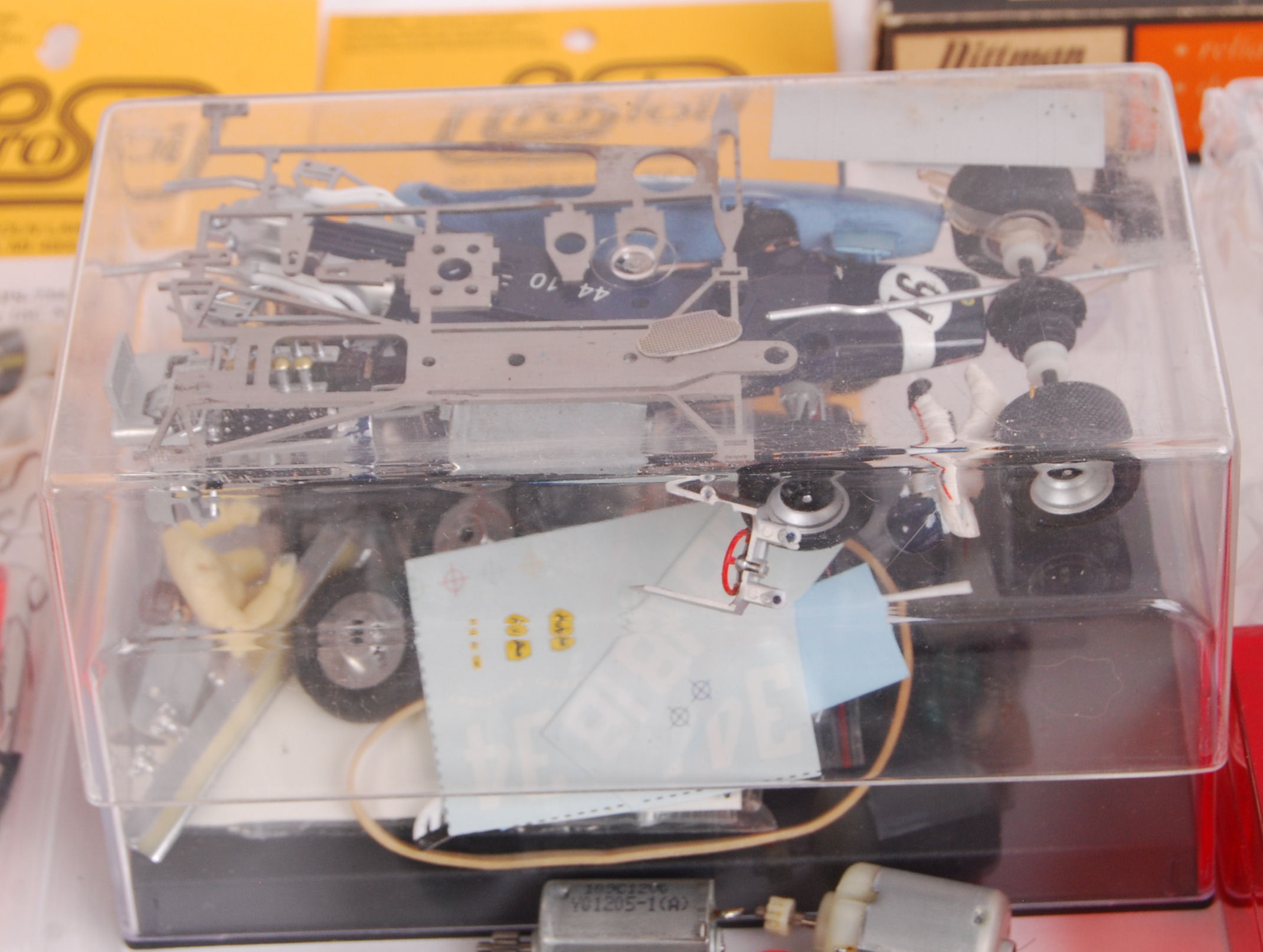 A large box of original contemporary slot car kits & accessories to