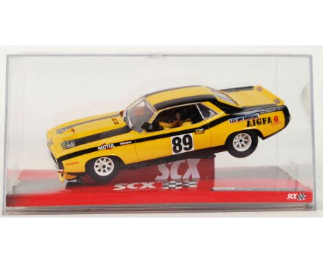 An original contemporary 1/32 scale SCX 64870 Plymouth AAR Cuda "Yellow" plastic racing slot car. Within its original plastic