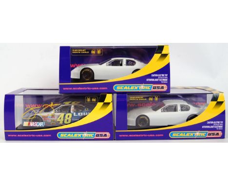 A collection of 3x original contemporary 1/32 scale Scalextric USA plastic racing slot cars to include; C2605 Chevrolet Monte