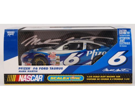 An original contemporary Scalextric Nascar 1/32 scale C2370 Pfizer #6 Ford Taurus plastic slot racing car. Within original pl