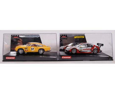 A collection of 2x original contemporary 1/32 scale Carrera Evolution plastic model slot cars to include; Aston Martin DB5 & 