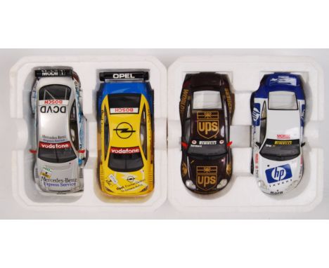 A collection of 2x original contemporary 1/32 scale Scalextric double packed racing slot cars. Within their original polystyr