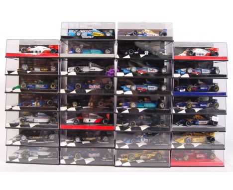 A large collection of 30x original 1/43 scale Minichamps diecast model F1 Formula One racing cars. Mint. All within their ori