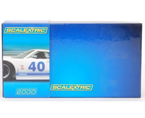 An original 2000 1/32 scale Scalextric 'limitierte edition' C2943A Ford GT40 slot car. Within its original box with plastic c