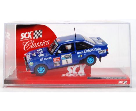 An original contemporary 1/32 scale SCX 63550 Ford Escort MKII "Eaton Yale #1" plastic racing slot car. Within its original p