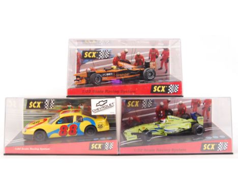 A collection of 3x original 2001 TecniToys SCX 1/32 scale racing system slot cars to include; 60440 Orange Arrows F1, 60570 M