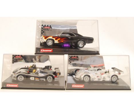 A collection of 3x original contemporary 1/32 scale Carrera Evolution plastic slot cars to include; 25466 Pontiac GTO 66, 254