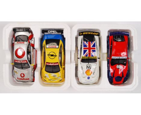 A collection of 2x original contemporary 1/32 scale Scalextric double packed racing slot cars. Within their original polystyr