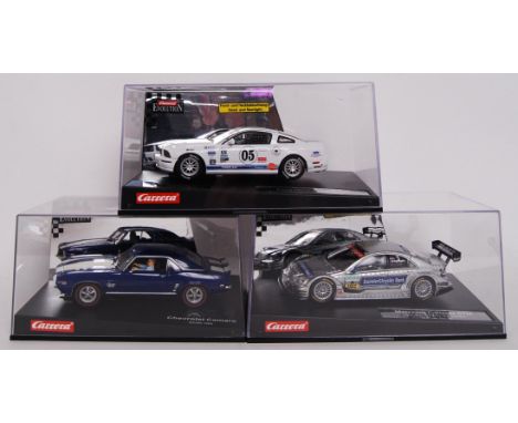 A collection of 3x original contemporary Carrera Evolution 1/32 scale plastic racing slot cars to include; 27134 Ford Mustang