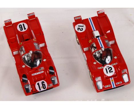 An original contemporary 1/32 scale Spirit Ferrari 512 M plastic slot car set. Both cars mounted with their original clear pl