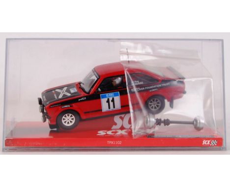 An original contemporary 1/32 scale SCX 64560 Ford Escort MKII "McRae" plastic racing slot car. Within its original plastic c