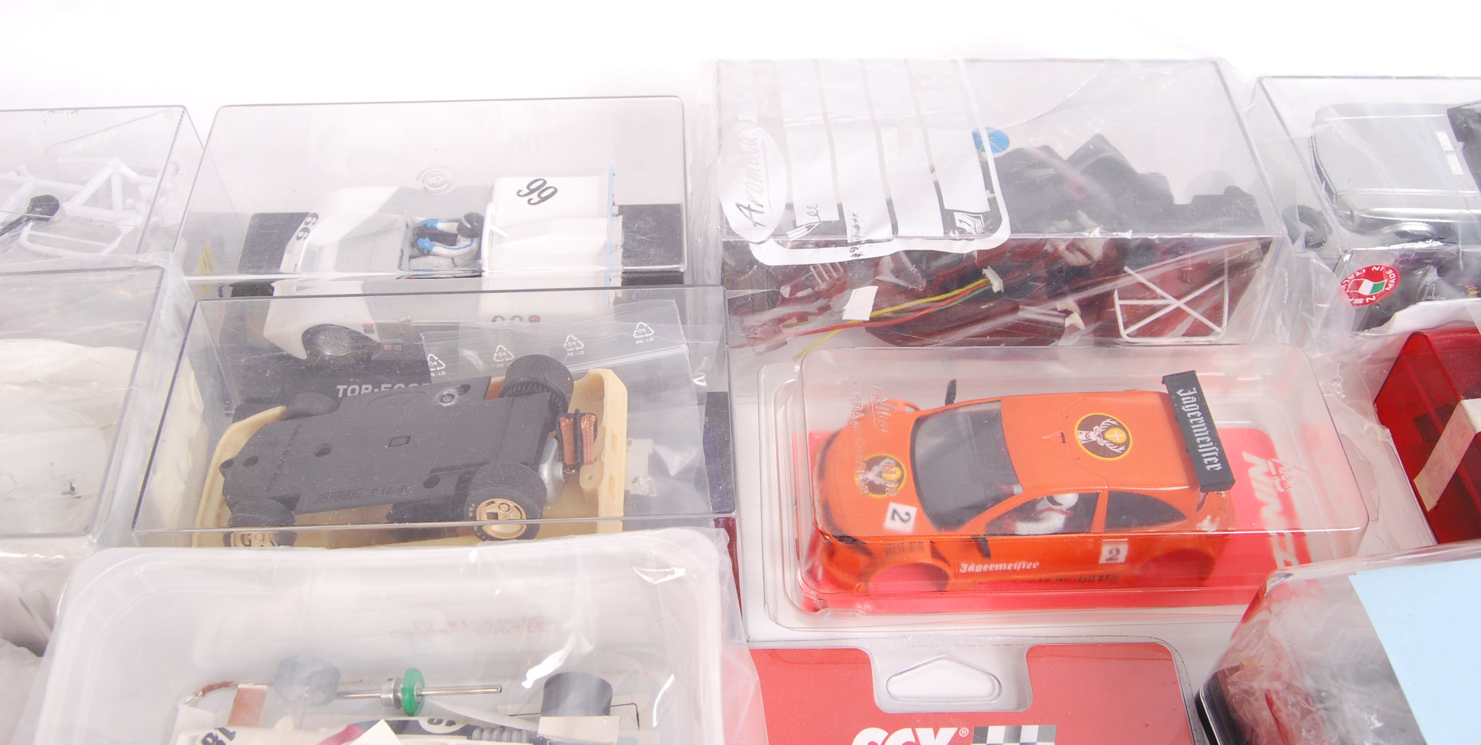 A large box of original contemporary slot car kits & accessories to