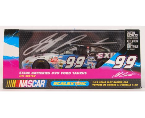 An original contemporary Scalextric Nascar 1/32 scale C2281 Exide Batteries #99 Ford Taurus plastic slot racing car. Within o