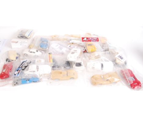 A collection of contemporary various branded loose slot car kits to include; chassis, stickers, model parts etc. All bagged. 