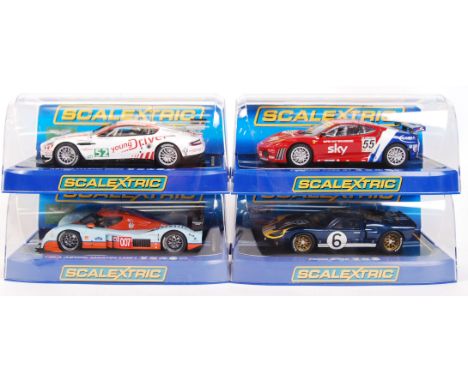 A collection of 4x original contemporary 1/32 scale Scalextric slot cars to include; C3196 Aston Martin DBR9, C3188 2010 Lola