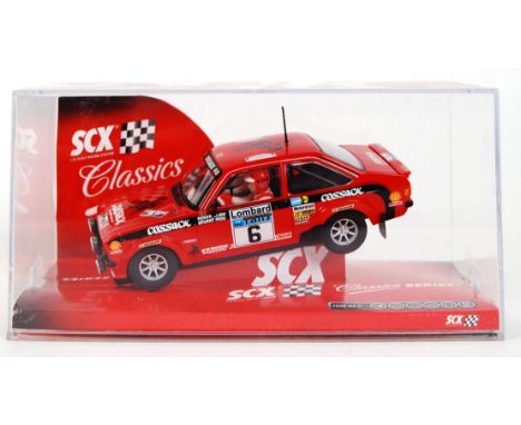 An original contemporary 1/32 scale SCX Classic Series 62800 Ford Escor MKII plastic racing slot car. Within its original pla