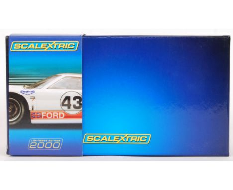 An original 2000 1/32 scale Scalextric 'limitierte edition' C2941A Ford GT40 slot car. Within its original box with plastic c