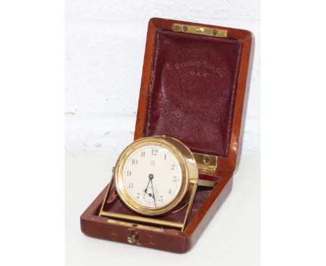 A small antique mahogany cased and brass travelling clock by Waterbury Clock Co of USA, the clock with hand wind mechanical m