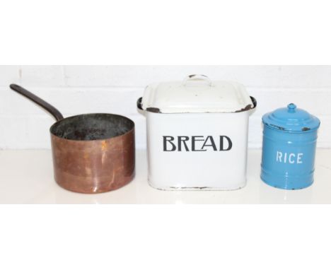 A vintage white enamel bread bin, a blue enamel rice container and an antique copper saucepan, the breadbin 28cm wide