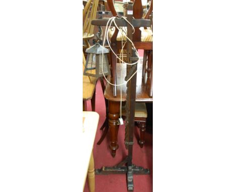 A moulded oak telescopic standard lamp in the form of a street lantern
