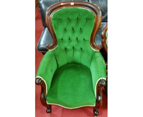 A Victorian style mahogany and green button back upholstered spoonback armchair, together with a similar nursing chair and a 