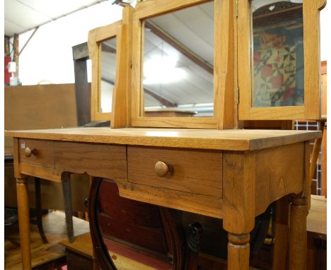 A light oak triptych mirror back kneehole two drawer dressing table