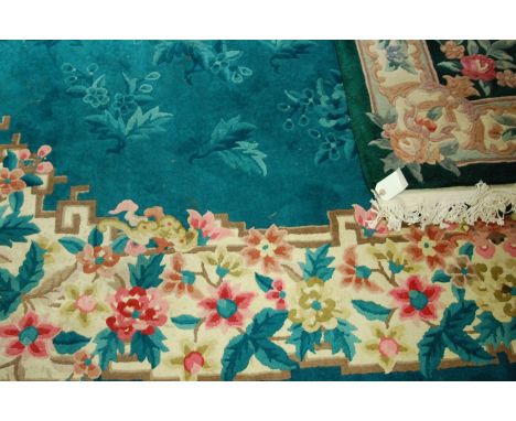 A Chinese Superwash green ground carpet, 306 x 246cm; together with a similar smaller rug (2)