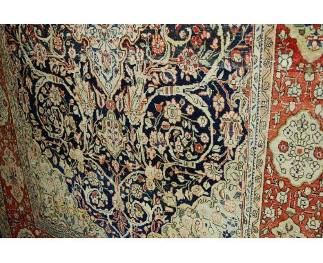 A Persian woollen Tabriz style carpet, 130 x 220cm Condition Report / Extra Information Areas of wear, mostly to centre.
Some