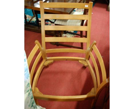 A contemporary Ercol light elm three piece lounge suite, comprising twin sofa and pair of armchairs (lacking upholstery)