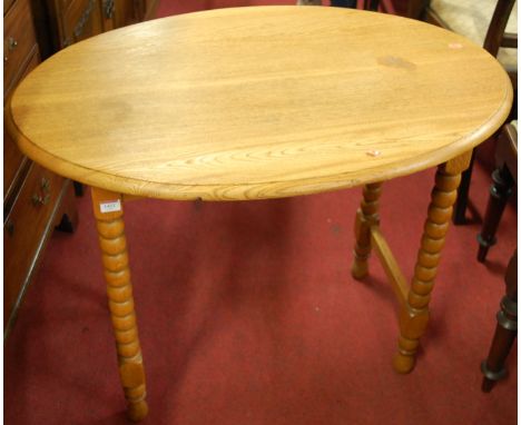 An early 20th century light oak oval bobbin turned occasional table