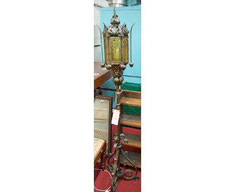A gothic style gilded wrought iron standard lamp 