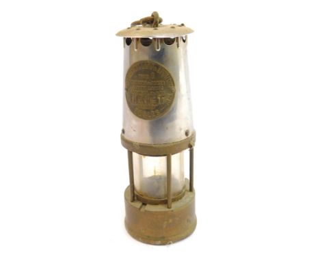 A Protector Lamp and Lighting Company Eccles miner's lamp, type 6, stamped Janet, with swing handle, 25cm high. 