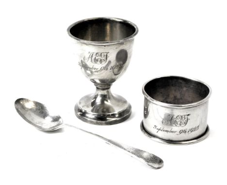 A George V silver Christening set, comprising egg cup, spoon and napkin ring, each engraved AEJ September 9th 1928, Birmingha