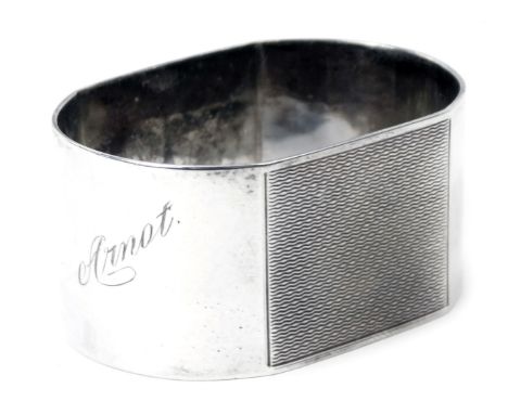 A George VI silver napkin ring, with partial engine engraved decoration and engraved Arnot, Birmingham 1939, 1.06oz, in prese