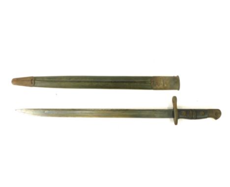 A World War I bayonet, with wired handle grip and steel blade, in material scabbard, stamped IAB with a crown, dated 1913, 2 