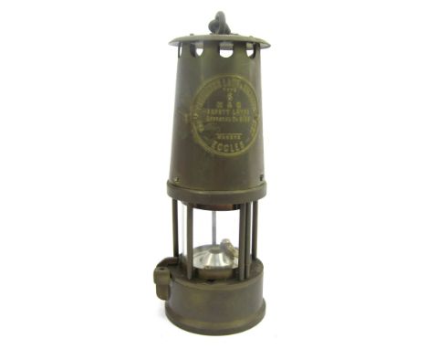 A Protector Lamp and Lighting Company Eccles brass miner's lamp, type S, with swing handle, 25cm high. 