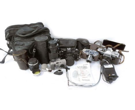 Various cameras and optics equipment, to include a Praktica B200 camera, a Sigma lens 936790, in case, a Halina 35X Super cam
