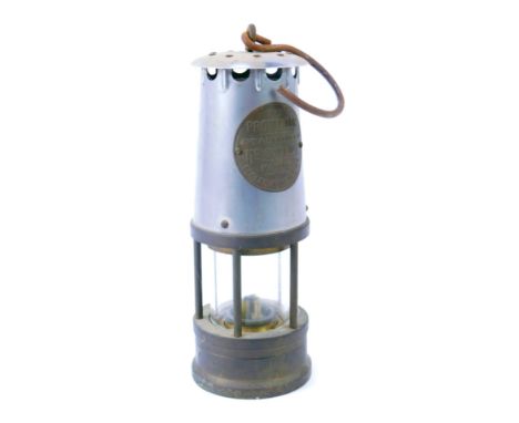 A Protector Lamp and Lighting Company Eccles mining lamp, type 1A, with swing handle, 24cm high. 