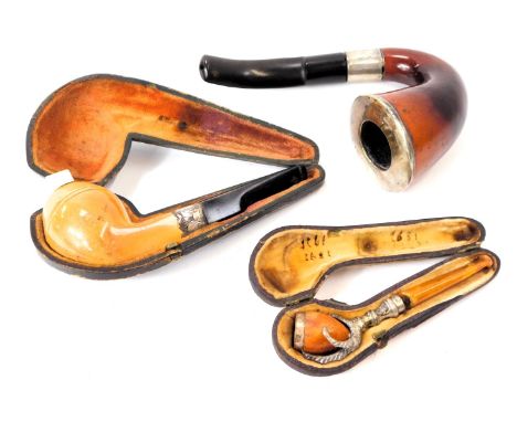 Three pipes, comprising a hand pipe, with silver collar, Birmingham 1910, a fruitwood and silver collared pipe, Birmingham 18