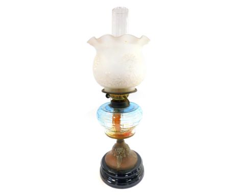 An early 20thC Duplex Art Nouveau oil lamp, an embossed copper base, blue glass reservoir, with chimney and floral frosted gl