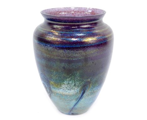 A Caithness iridescent glass vase, in blue and purple design, with swirls, 20cm high. 