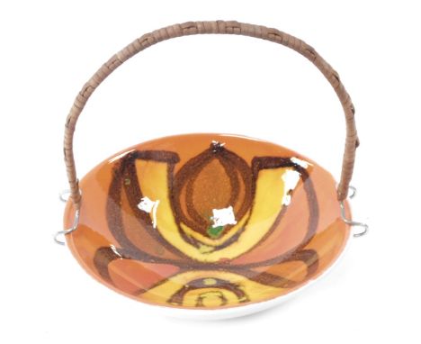 A Poole Delphis pottery reeded dish, on the orange Delphis ground, with a later attached steel and bamboo twist handle, print