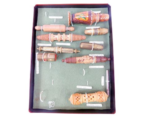 A group of needle cases, to include a wooden example modelled as a rolling pin, carved wooden Austrian case, vegetable ivory 