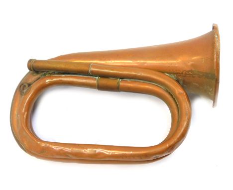 A Besson and Co London copper bugle, dated 1940, 24.5cm long. 