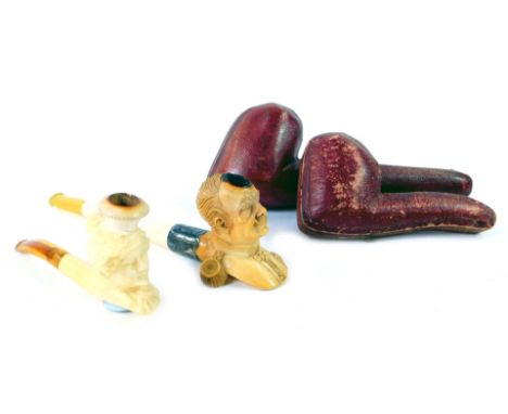 A meerschaum pipe modelled as Kaiser Wilhelm II, 15cm long, in leather case, together with a further meerschaum pipe modelled