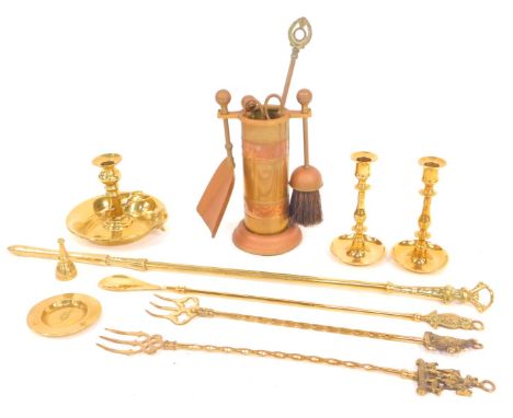A group of brassware, to include fireside implements, poker, toasting fork, candlesticks, chamberstick, etc. 