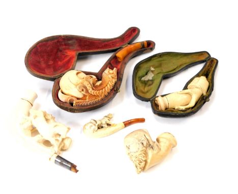 A group of meerschaum type pipe and pipe parts, comprising short handled, long handled, two in fitted case, carvings of horse
