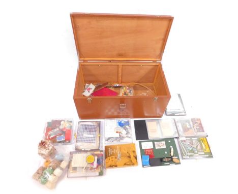 A group of sewing related items, knitting, various scissors, thread, embroidery transfers, mending kits, embroidery hoop, etc