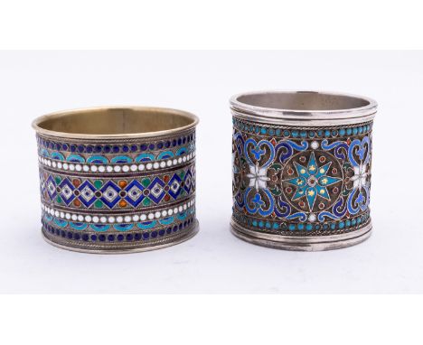 A late 19th century Russian silver and enamel napkin ring marked 88 A.B, decorated with stars and scrolls, 4.3cm. wide, 54gms